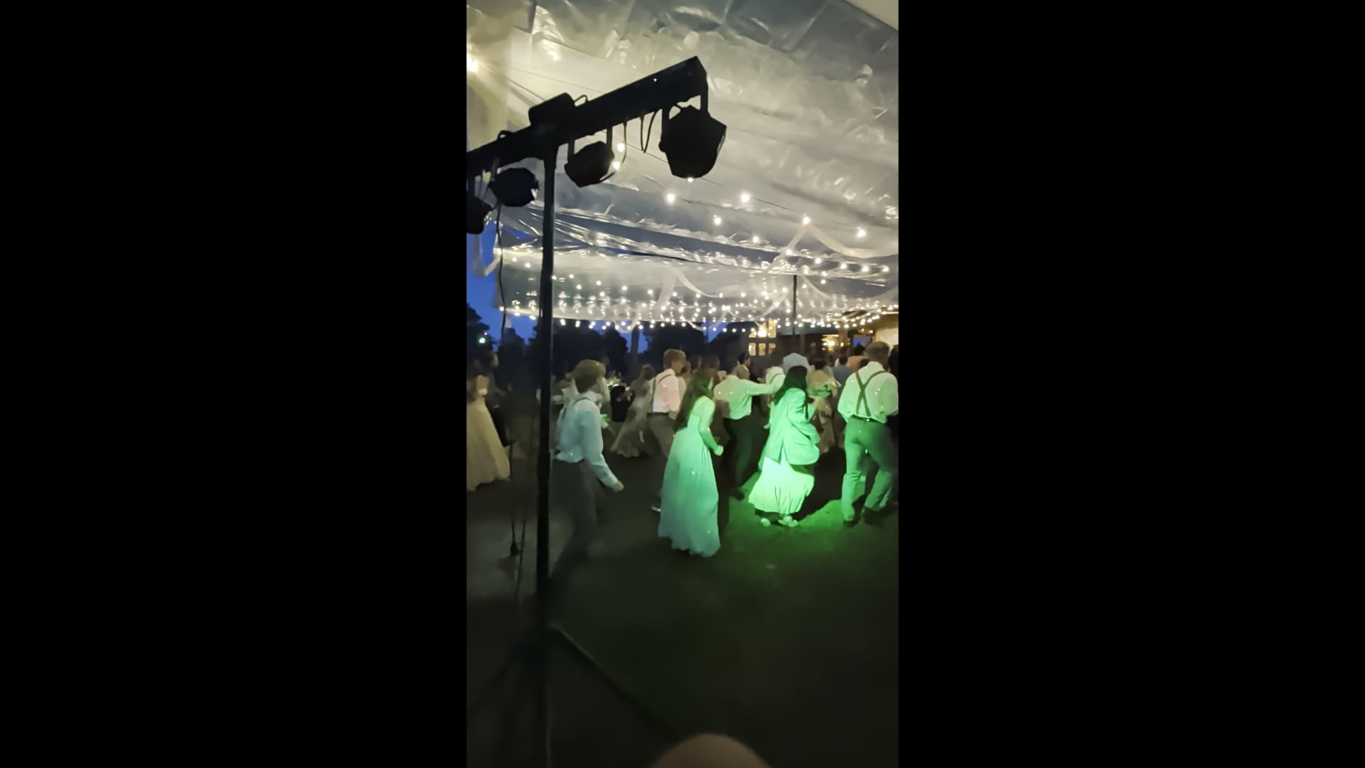 Guests dancing under Brink Productions dance lighting at a Black Hills event